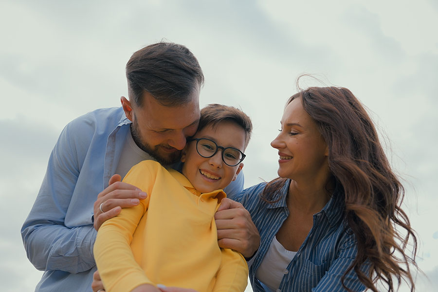 A happy couple with a young boy