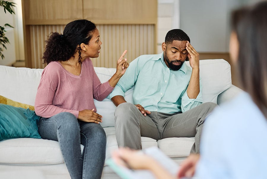 An arguing couple with a therapist