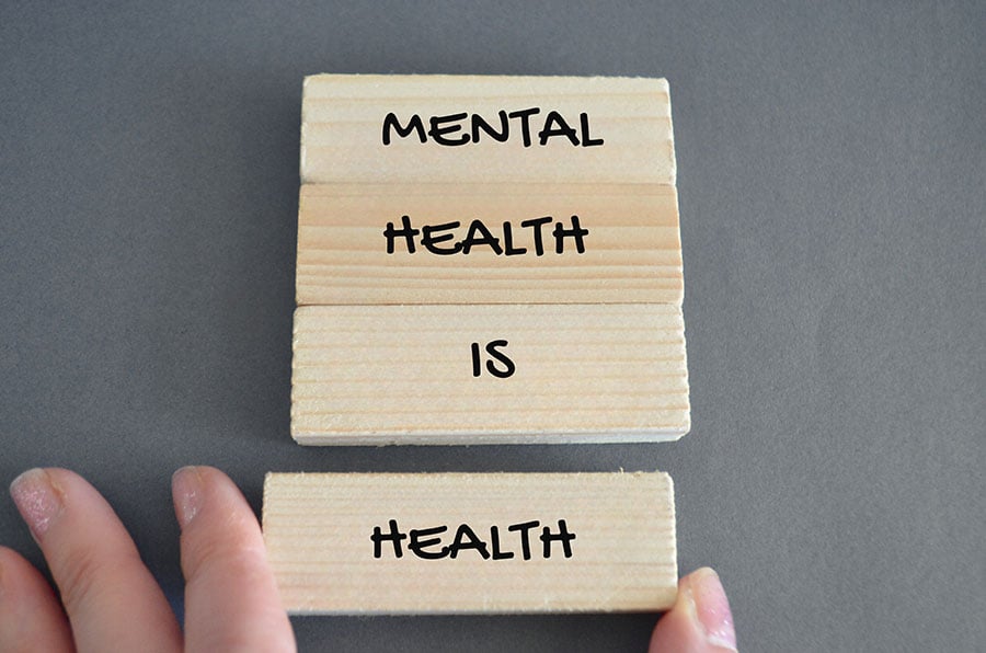 The words mental health is health written on wooden blocks
