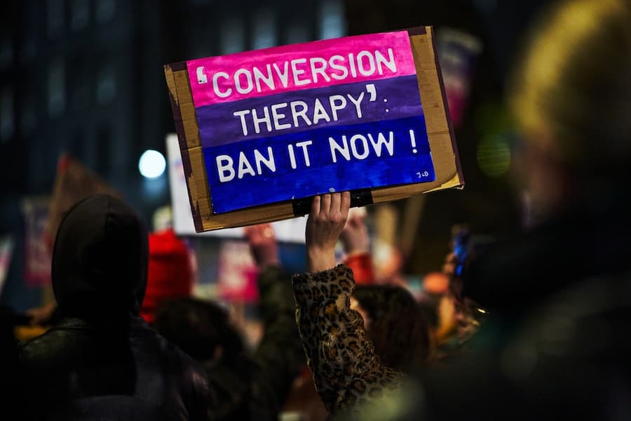 Ban conversion therapy sign on a protest march in London