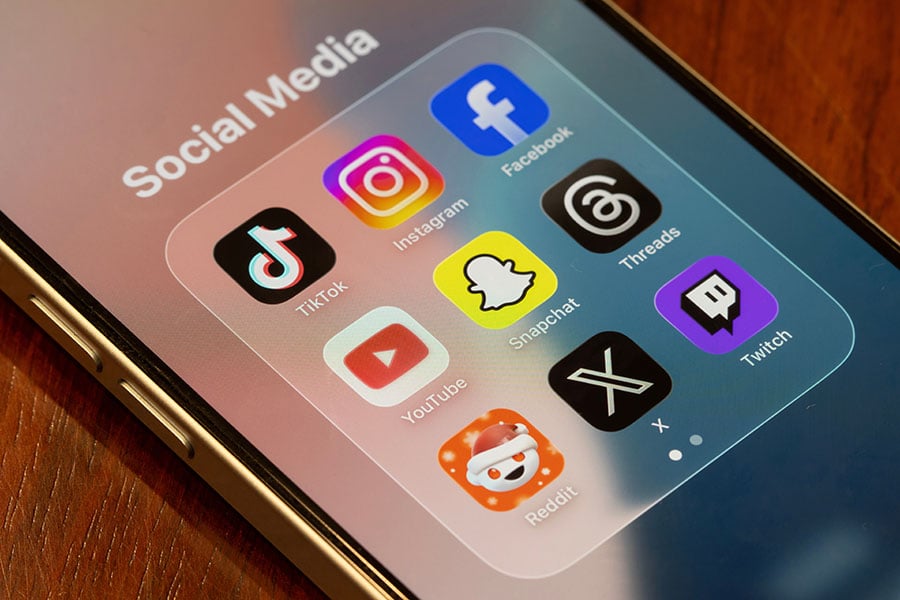 A phone screen displaying logos of social media platforms