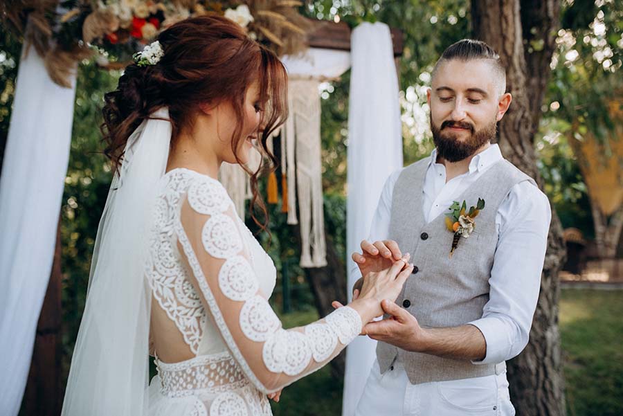 A couple get married in a forest